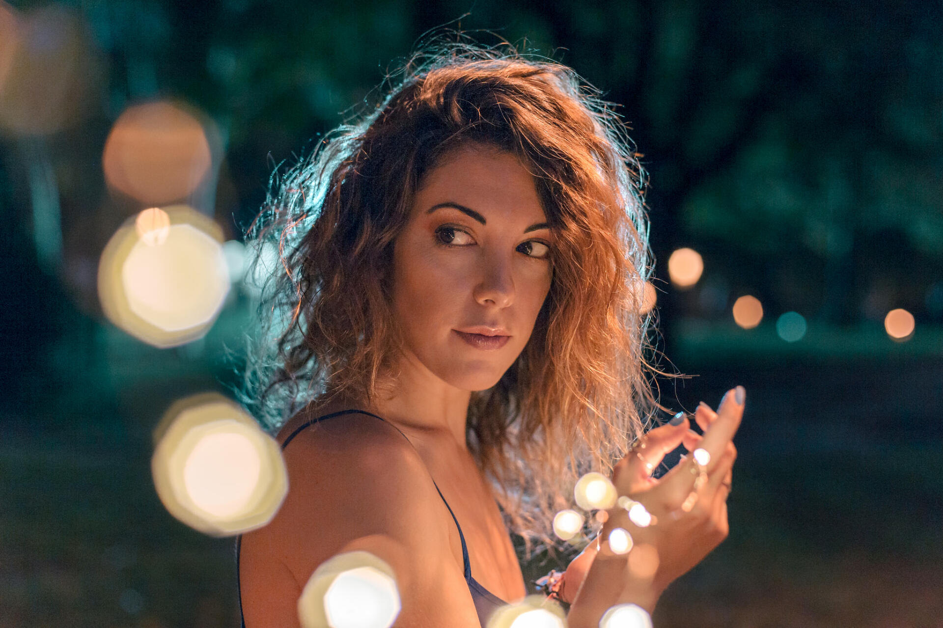 Girl holding a LED strip with a rim light